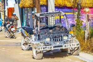 Holbox Mexico 22. December 2021 Golf cart buggy cars carts muddy street village Holbox Mexico. photo