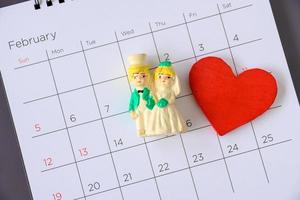 Miniature married couple on the calendar. photo