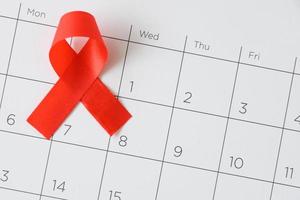 World AIDS day concept, red ribbon the date 1 December