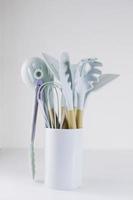 Kitchen tools on the table on a white background. photo