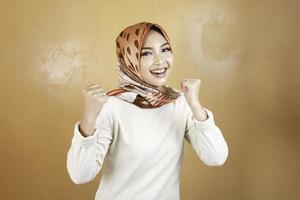 Beautiful muslim woman enthusiast, celebrating, yes. Success concept photo