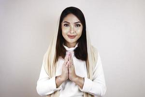 Portrait young beautiful Muslim woman wearing a hijab. Eid Mubarak greeting photo