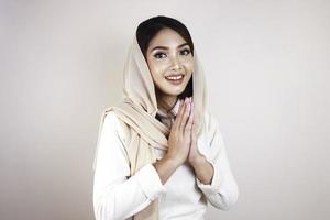 Portrait young beautiful Muslim woman wearing a hijab. Eid Mubarak greeting photo