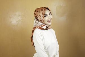 Cheerful young beautiful Asian Muslim woman smiling. photo