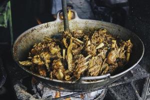 cooking tengkleng kambing or goat tengkleng is a kind of soup with the main ingredient of goat bones. photo