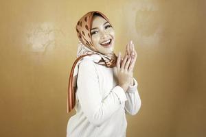 Cheerful young beautiful Asian Muslim woman smiling. photo