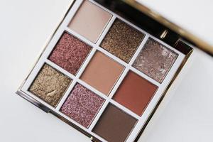 Eyeshadow palette on white background. Makeup palette close up photo