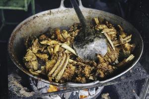 cooking tengkleng kambing or goat tengkleng is a kind of soup with the main ingredient of goat bones. photo