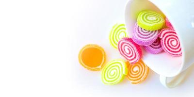 colorful sweets and sugar candies on a white background photo