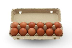 Chicken eggs in brown kraft paper isolated on white background with clipping path photo