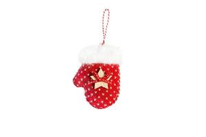 Red knitted mitten with white fur, decorated with a wooden star and a bow with a striped loop for decorating the Christmas tree. Isolate on a white background. Christmas decor, new year, MITT photo