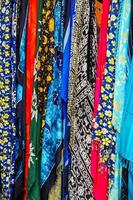 Multicoloured Silk Scarves on a Market Stall in Madeira photo
