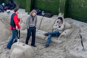 London, Uk, 2008. Chilling in a sand lounge by the River Thames photo