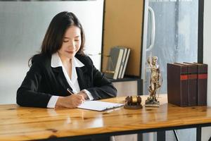 female lawyers working at the law firms. Judge gavel with scales of justice. Legal law, lawyer, advice and justice concept. photo