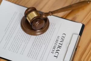 Legal contracts are subject to commercial disputes resolved in the courts of justice, contract with gavel. photo