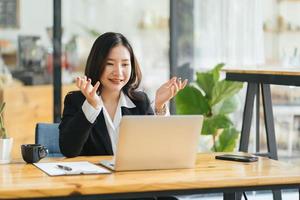 Photo of young happy positive cheerful good mood businesswoman having video call explaining new project at home house