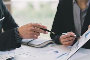 Close up of working process at business meeting,Business partners discussing graph of financial, business concept. Business Concept. select focus. photo