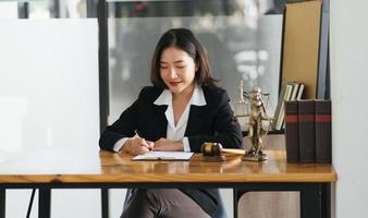 female lawyers working at the law firms. Judge gavel with scales of justice. Legal law, lawyer, advice and justice concept. photo