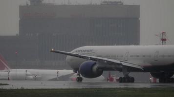 Plane on the runway, heavy rain video