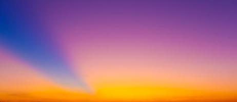 The blurred colorful sky background of the twilight sun in evening. photo