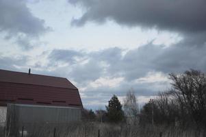 Thunderclouds in the evening on the sky in the village photo