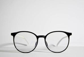 black eyeglass frames on a white background. photo