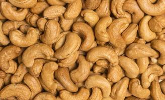 op view roasted golden cashew nuts healthy food protein-rich for background, close-up shot. photo