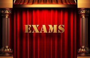 exams golden word on red curtain photo