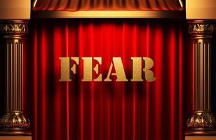 fear golden word on red curtain photo