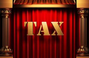 tax golden word on red curtain photo