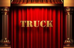 camión palabra dorada en cortina roja foto