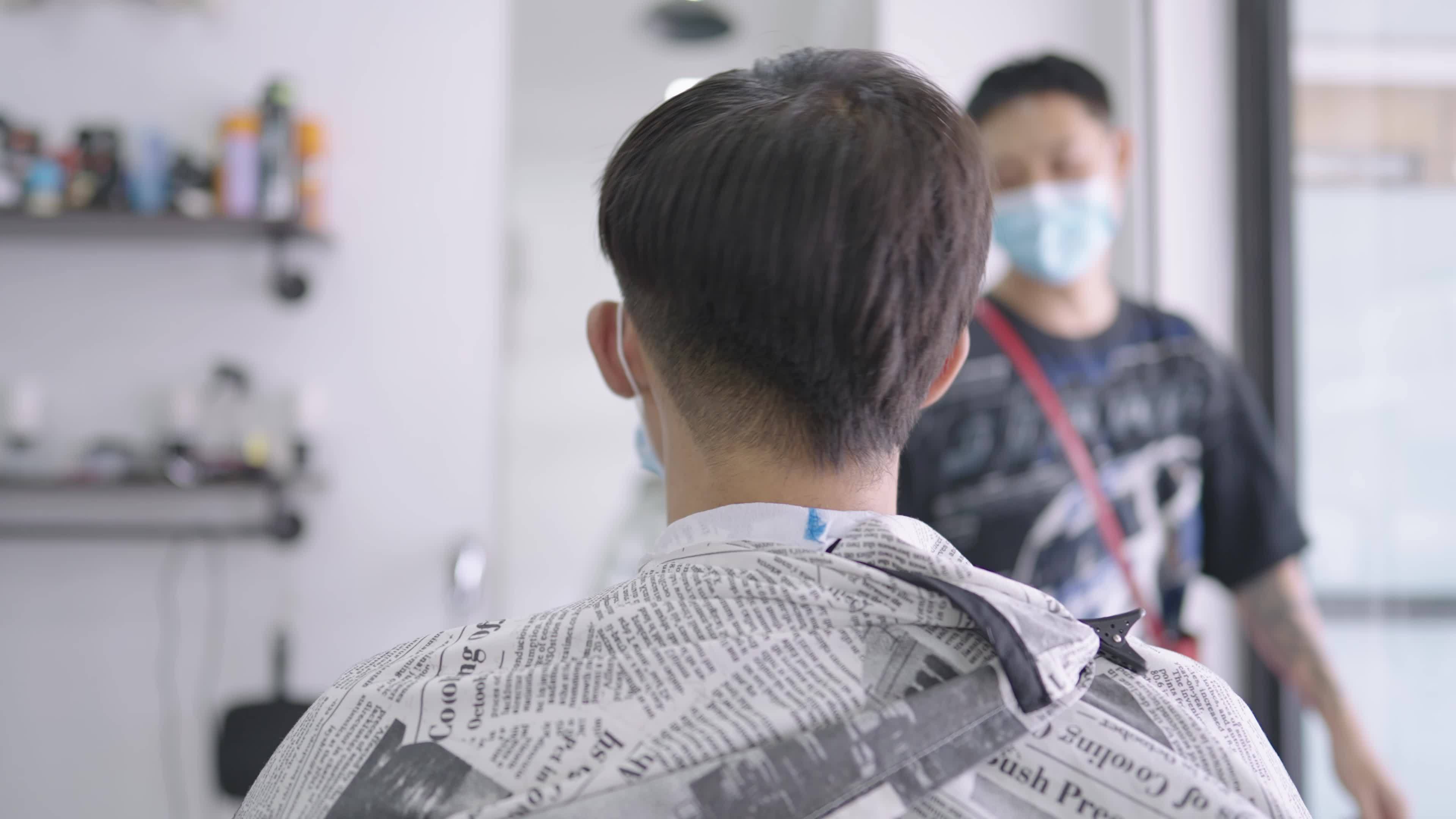 Asian young man get hair cut during quarantine pandemic waiting for service view from behind, guy barbershop reopening business, men hair designer creation, customer service job, male hygiene 7366882 Stock Video at Asian young man get hair cut during quarantine pandemic waiting for service view from behind, guy barbershop reopening business, men hair designer creation, customer service job, male hygiene 7366882 Stock Video at