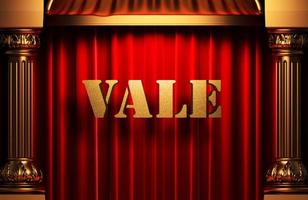 vale golden word on red curtain photo