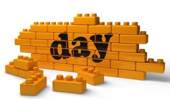 day word on yellow brick wall photo