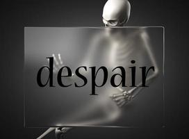 despair word on glass and skeleton photo