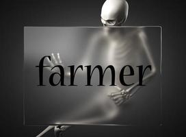 palabra de granjero sobre vidrio y esqueleto foto