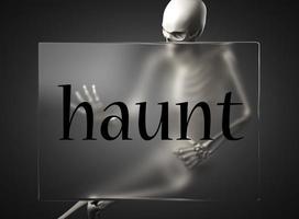 haunt word on glass and skeleton photo