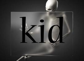 kid word on glass and skeleton photo