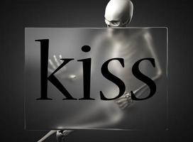 kiss word on glass and skeleton photo