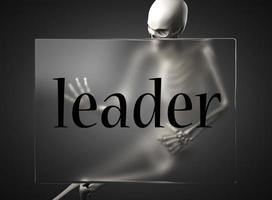 palabra líder sobre vidrio y esqueleto foto
