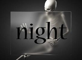 night word on glass and skeleton photo