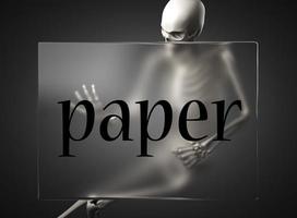 palabra de papel sobre vidrio y esqueleto foto