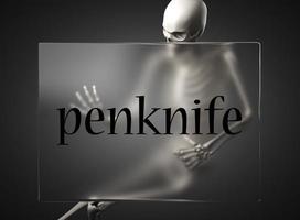 penknife word on glass and skeleton photo