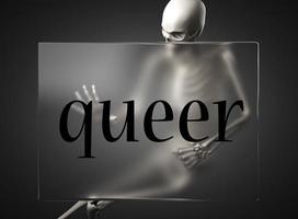 queer word on glass and skeleton photo