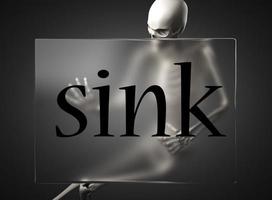 sink word on glass and skeleton photo