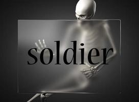 palabra soldado sobre vidrio y esqueleto foto