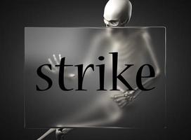 strike word on glass and skeleton photo