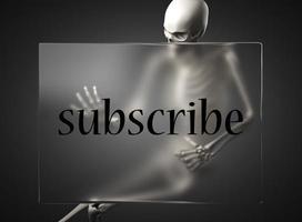 subscribe word on glass and skeleton photo