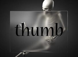 thumb word on glass and skeleton photo