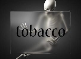 tobacco word on glass and skeleton photo